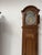 Louis xv style grandfather clock with a gendarme's hat top finely carved solid oak single-bell movement with a pewter face...