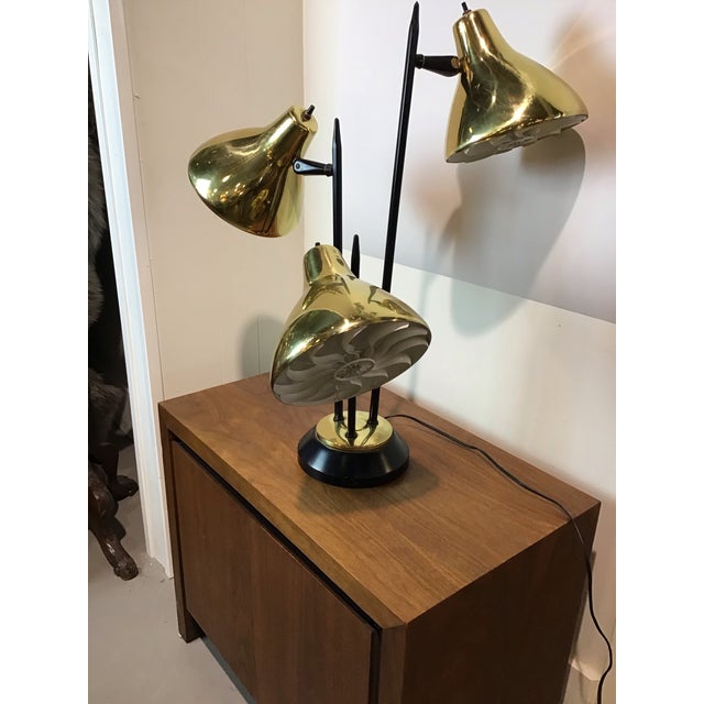 Iconic mid-century modern “Triennale” style table lamp in the manner of Thurston, featuring three adjustable cone shades...