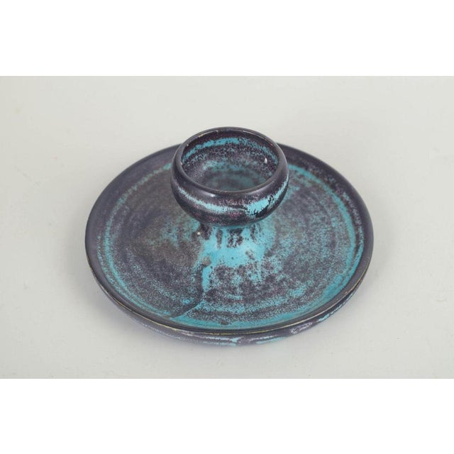 Svend Hammershøi for Kähler Candlestick, 1930s. Low, circular stoneware candlestick with a centrally positioned candle...
