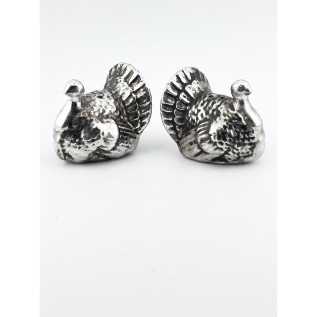 Add a touch of refined seasonal elegance to your table with this charming pair of vintage turkey salt and pepper shakers....