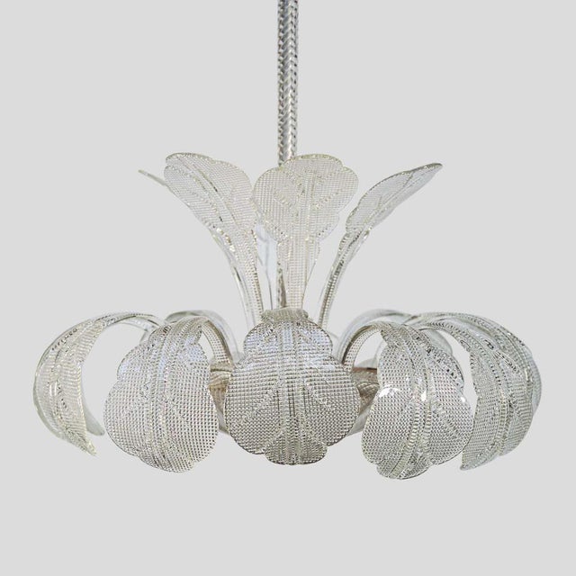 A 1950s Italian ceiling light clear blown and patterned glass with leafage upwards and downwards ,by Barovier & Toso This...