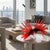 This original sculpture is by Canadian artist John Paul Robinson and features a spiraled fan of red glass feathers with...