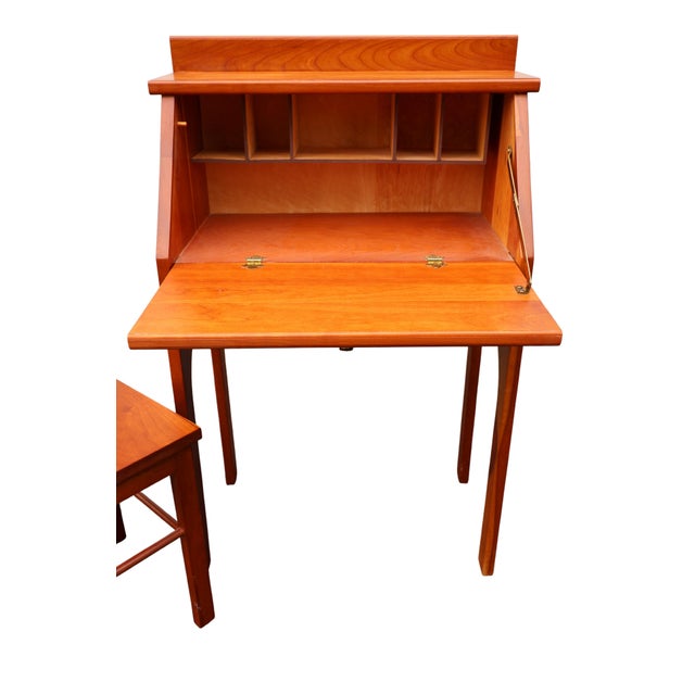 A wonderfully uncommon custom-handcrafted child-size secretary desk with its matching spindle-back chair, dating to...