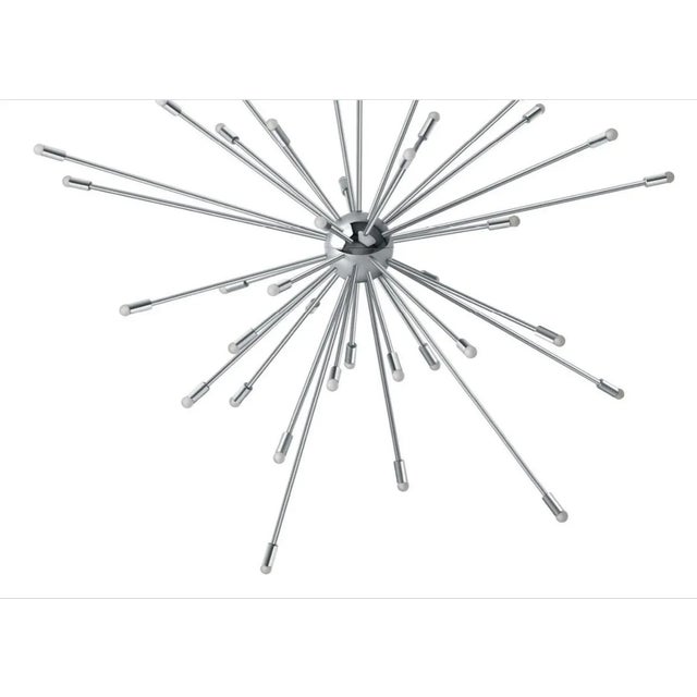 Galaxy is a pendant lamp born in the late 1940s from the genius of Charles and Ray Eames, assembling brass tubes and...