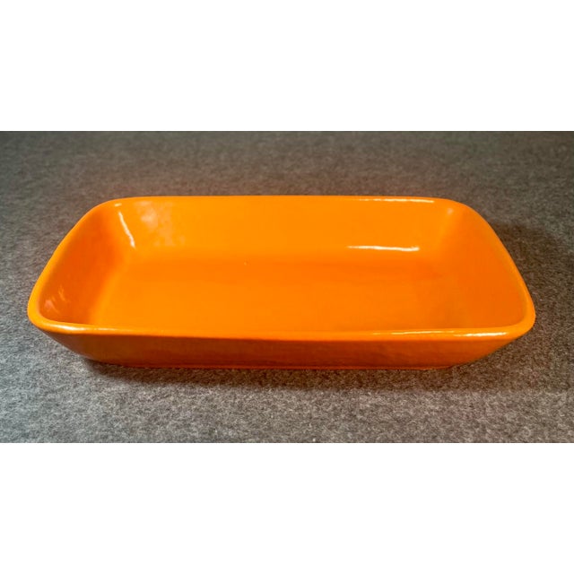 Mid Century Modern solid tangerine orange art pottery tray by Stangl (USA).