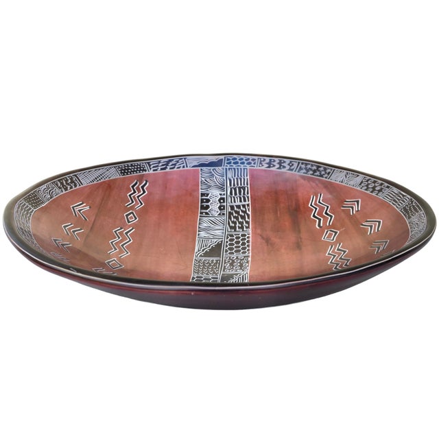 Beautiful vintage West-African bowl thoughtfully hand-carved from natural very heavy soapstone with ornate sculptural...