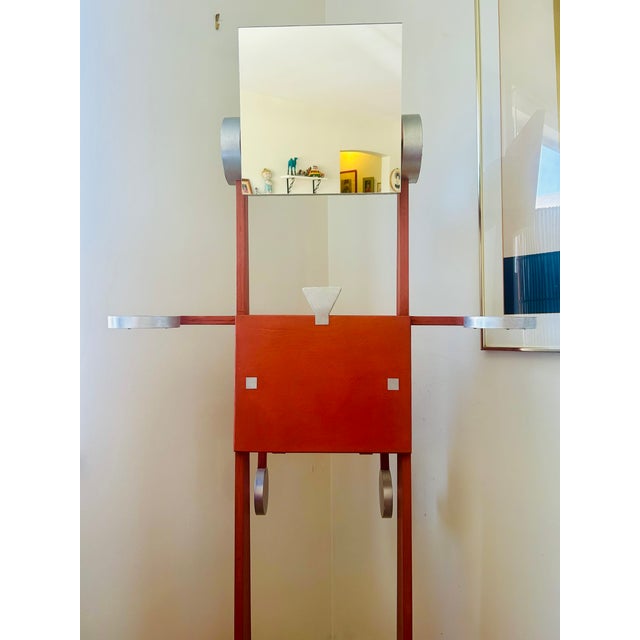 Striking sculptural valet stand in the form of a stylized “robot” figure, blending functional design with playful...