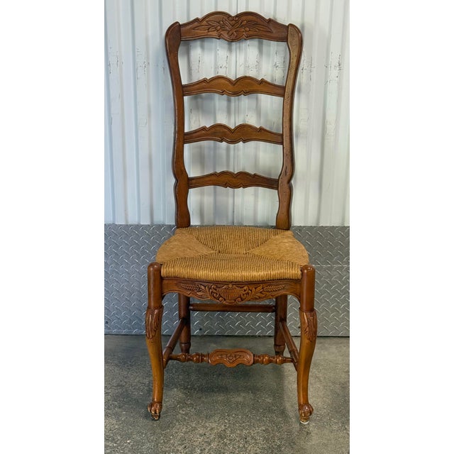 Habersham ladder-back chairs are classic examples of European farmhouse design. Chairs feature elegantly carved crest...