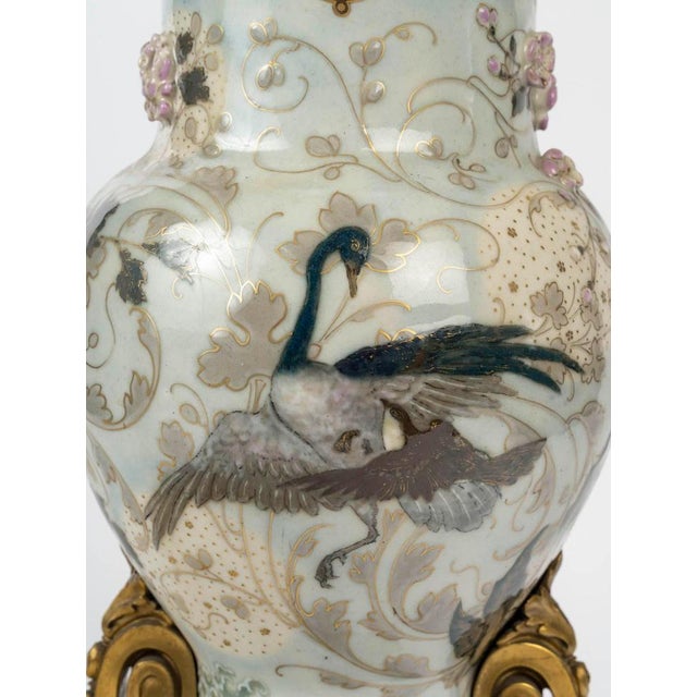 Large enameled porcelain vase by Albert Damousset, early 20th century. Vase by Albert Damousset, for the Manufacture de...