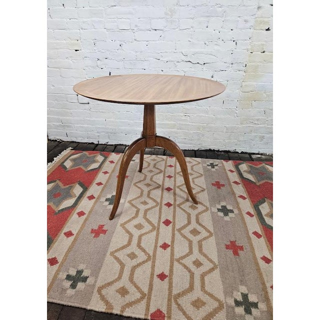 Edward Wormley for Dunbar circular side table with tripod legs. An elegant, collector-grade mid-century modern circular...