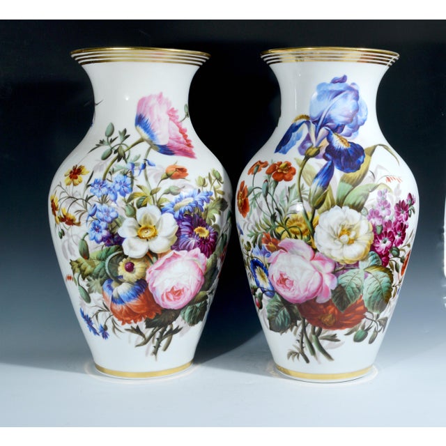 Pair of Paris Porcelain Botanical Vases, Mid-19th century. Each of the baluster form porcelain vases has a cylindrical...