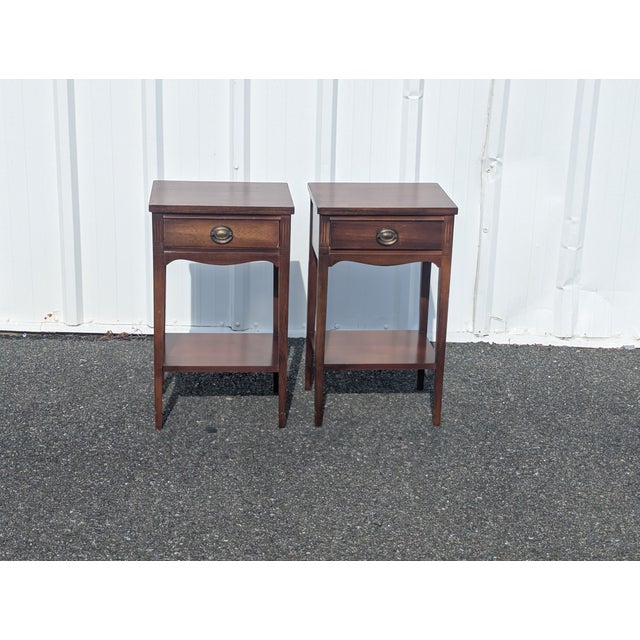 Transform your bedroom into a sophisticated sanctuary with this stunning pair of Dixie Federal style mahogany tiered...