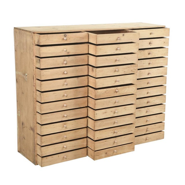 36 -drawer storage unit in raw wood. This piece is designed in the style of the selected designer and/or manufacturer