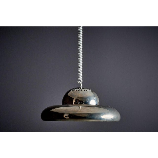 The Fior di Loto suspension lamp was designed by Tobia Scarpa and made by Flos. It provides mainly indirect lighting...