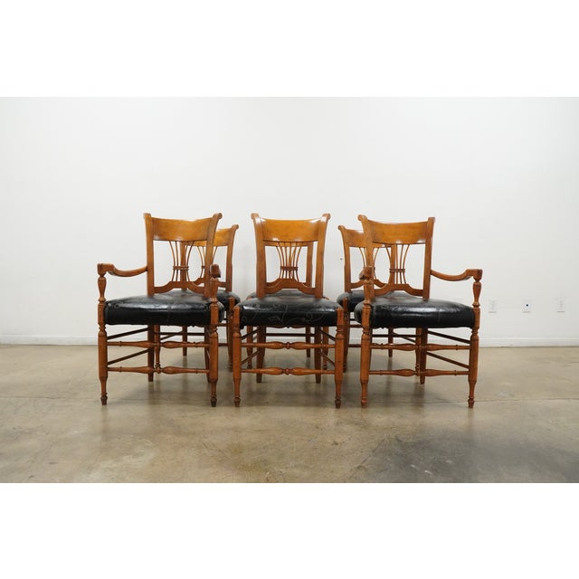 A beautiful vintage set of six Milling Road by Baker dining chairs featuring an elegant Neoclassical-inspired design made...