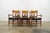 A beautiful vintage set of six Milling Road by Baker dining chairs featuring an elegant Neoclassical-inspired design made...