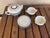 I purchased this Teapot, sugar creamer and teapot rest more than 40 years back. The vintage ceramic tea set features a...
