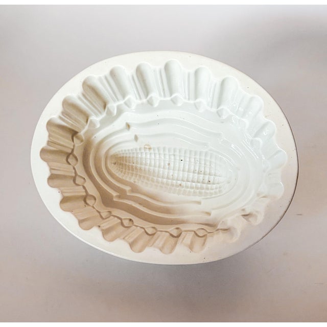 Excellent antique Victorian jelly or aspic mold with a scalloped rim and a corn cob design. A beautiful piece of history,...