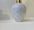 A stylish ovoid ceramic vase decorated with gold glaze on a white main body. Un-identified Scandinavian/German...