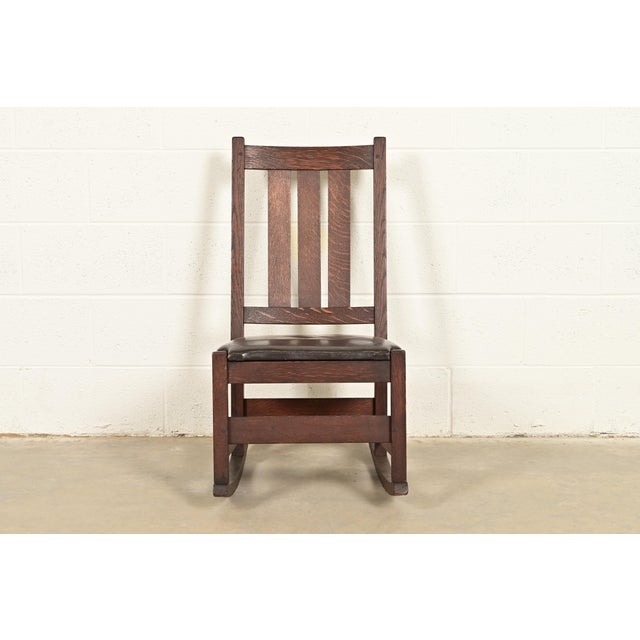 A gorgeous antique Mission or Arts & Crafts period rocking chair By L. & J.G. Stickley USA, Circa 1910 Quarter sawn oak,...