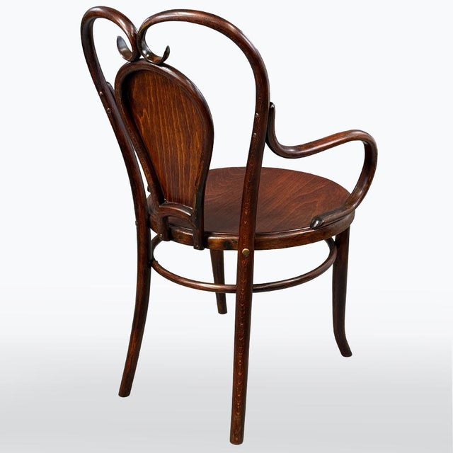 The chair has been restored. Unfortunately, the original wicker seat did not survive and has been replaced with beech...