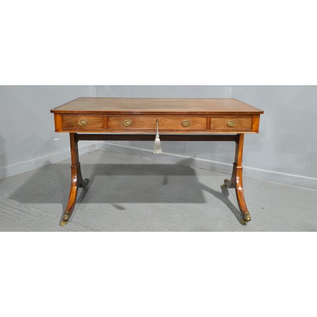 A excellent quality three drawer mahogany writing table, paw castors, original leather top, excellent overall condition....