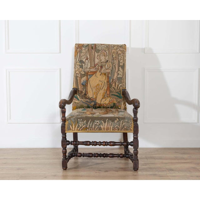 A French Baroque spool armchair in walnut, dating to the 17th century during the Louis XIV period. The frame is defined by...