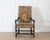 A French Baroque spool armchair in walnut, dating to the 17th century during the Louis XIV period. The frame is defined by...