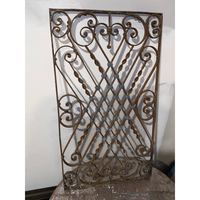 Wrought iron decorative panels like this have a long history, often used as architectural elements in gardens, balconies,...