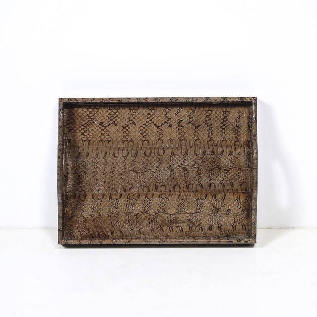 This Mid-Century Modernist python skin tray, crafted by the renowned designer Karl Springer circa 1980, is a striking...