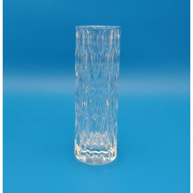 Elevate your space with the timeless elegance of this vintage German crystal vase. Featuring a striking geometric leaf-...