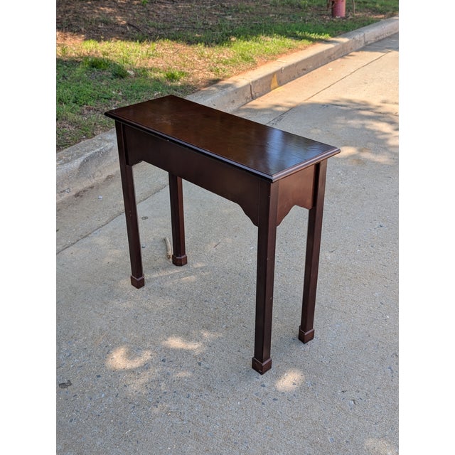 This timeless and refined console table embodies classic Chippendale-style elegance with its traditional craftsmanship and...