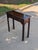 This timeless and refined console table embodies classic Chippendale-style elegance with its traditional craftsmanship and...