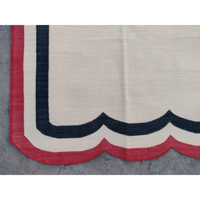 Handmade Cotton Vegetable Dyed Scalloped Edge Rug in Cream With Black and Red Border - 6x9 For Sale - Image 10 of 11
