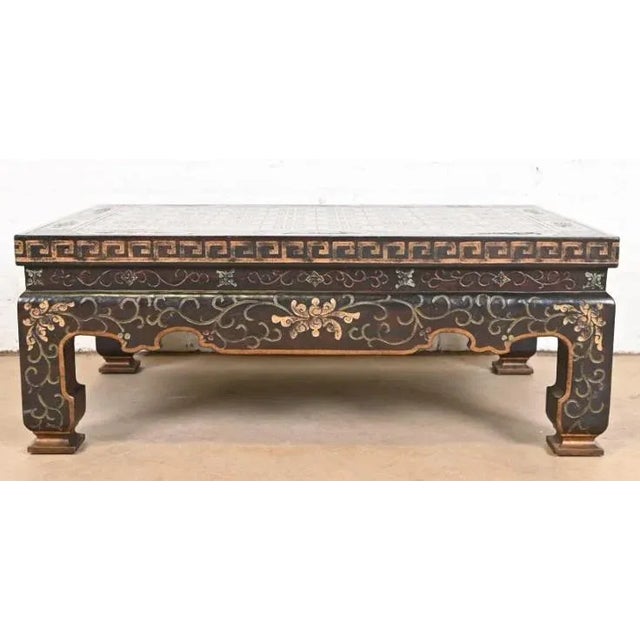 An exceptional Hollywood Regency Chinoiserie Coromandel coffee or cocktail table with floral and Greek key designs By...