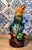 This intake, yet beautifully bright ceramic parrot cockatoo bird sitting upon a perch has been glazed in blue, green,...