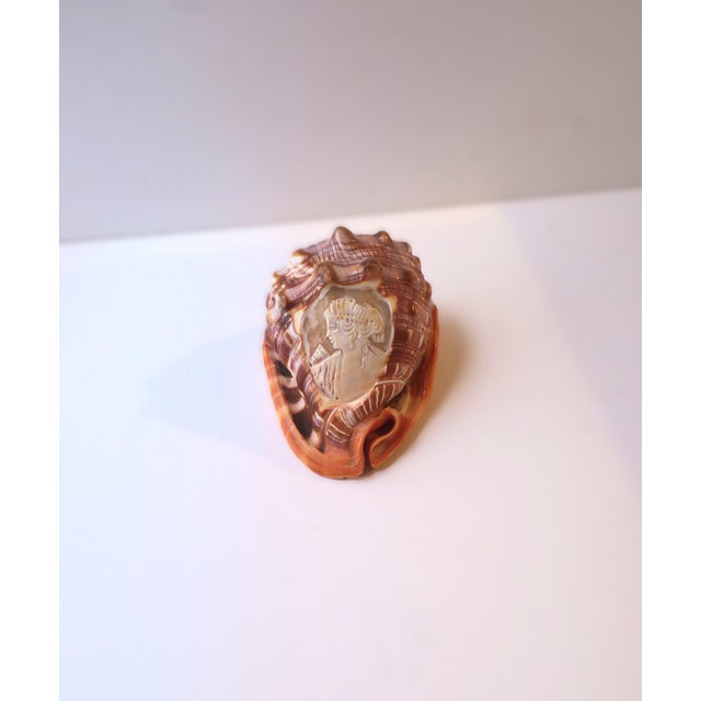 An Italian cameo seashell, Neoclassical Revival style, circa mid‑20th century (1950s–1970s), Italy. A well‑proportioned...
