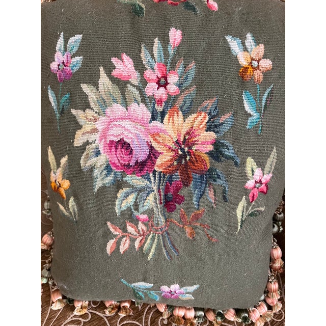 A beautifully crafted decorative pillow upholstered in an Aubusson tapestry, featuring a charming floral design on a rich...
