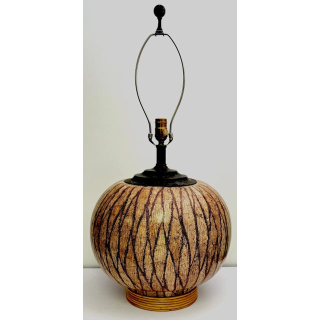 Mid-Century Modern Lacquered Coconut Shell Inlay Gourd-Form Table Lamp on Rattan Base, Mid-20th Century A beautifully...