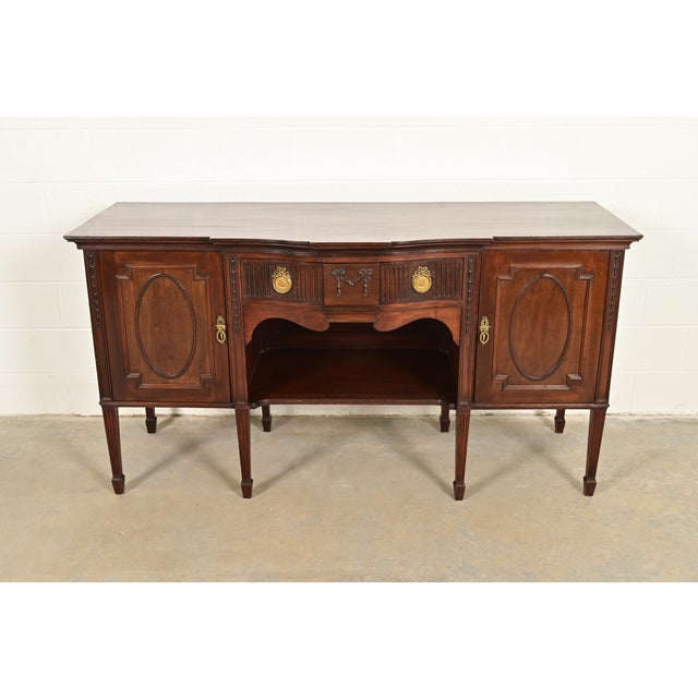 A gorgeous antique French Regency Louis XVI style sideboard, buffet, or bar cabinet In the manner of Berkey & Gay USA,...