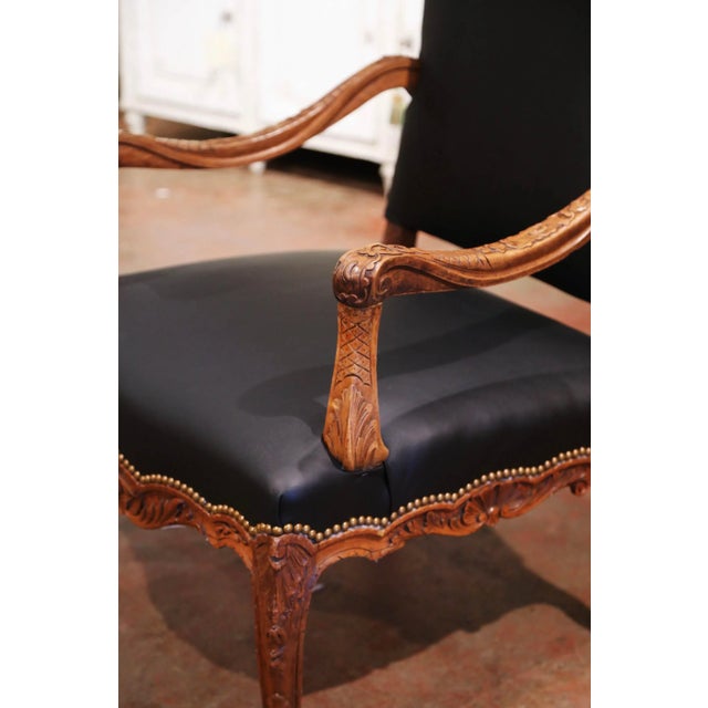 This handsome antique armchair was crafted in southern France circa 1880 and reflects the sculptural elegance of the Louis...