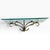 Striking vintage Hollywood Regency wall shelf featuring a clear glass shelf with a subtle aqua-green edge, supported by an...