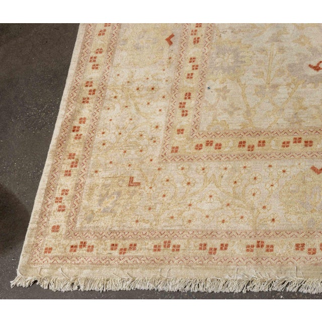 Turkish Oushak Wool Carpet, with floral design on beige and muted red ground. 18' L x 11' 11" W. Provenance: From a...