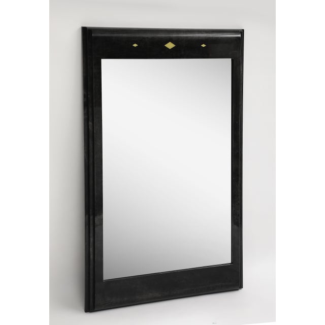 20th century black goat skin & lacquer wall mirror in the style of Karl Springer. Three gold leaf diamond accents at the top.