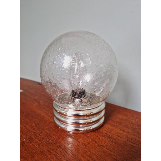 Table/bedside lamps in bubbled glass and silver plastic base, Space Age style, 70s. It is compatible with an E14 LED bulb....