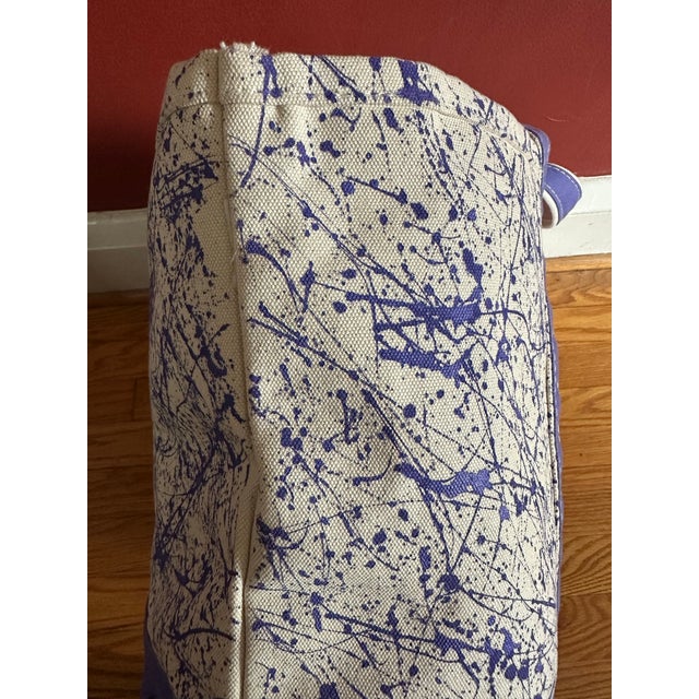This is a one of a kind hand splatter painted purple and natural canvas tote bag. Its a modern, unique take on a classic....