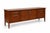 DESCRIPTION A clean, modern mid-century (MCM) inspired walnut credenza featuring a streamlined silhouette, balanced...