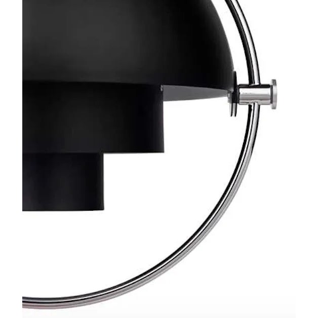 Louis Weisdorf 'Multi-Lite' pendant lamp in black and brass. Designed in 1972 by Weisdorf, this is an authorized re-...