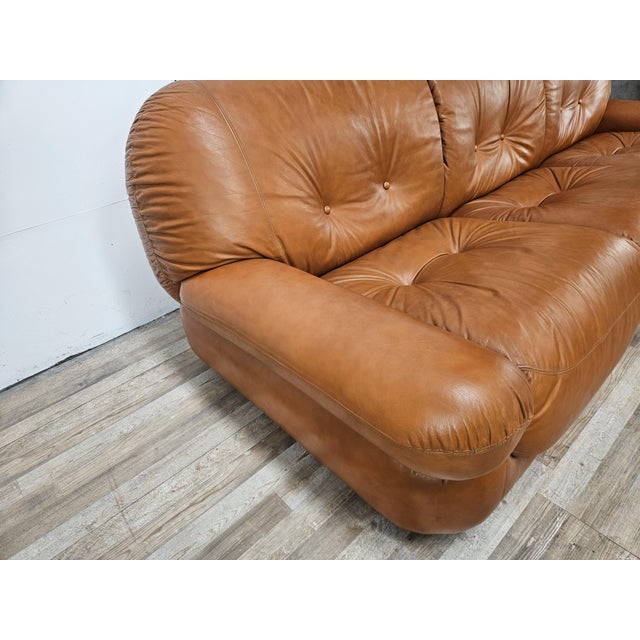 The iconic Sapporo sofa, produced by Mobil Girgi in the 1970s, features soft, generous, and enveloping lines, typical of...