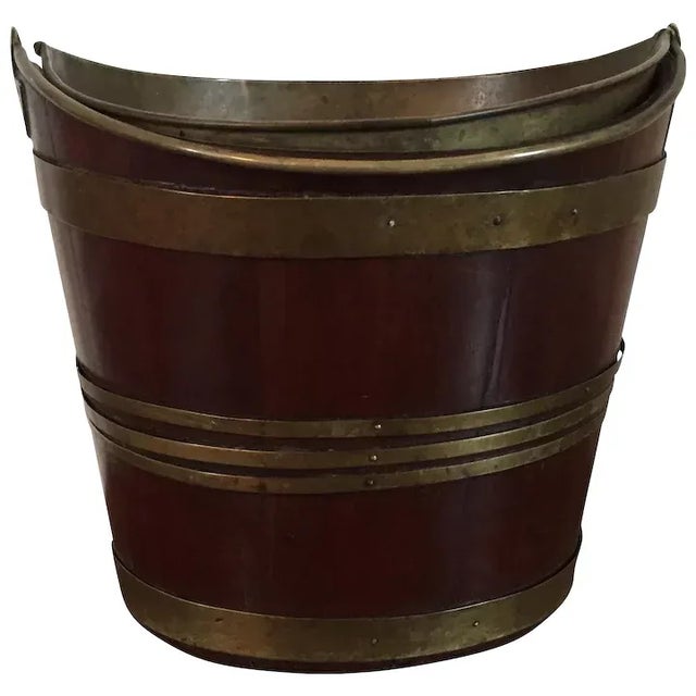 Antique early 19th century English Regency nanette shape mahogany peat bucket with brass liner and bail handle. Good color...